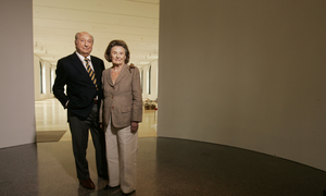 Raymond and Ruth Perelman stand in the entryway to their namesake building's Exhibition Gallery. The couple's gifts - such as the $15 million they gave the Art Museum in 1999 toward the purchase of the building - are made in both names. Likewise, they bought their myriad pieces of art by mutual consent. "There's very little they don't agree upon," their son Ron says.