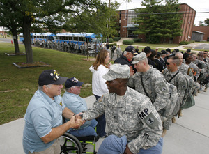 Vietnam vets from New Jersey have ready handshakes to greet troops returning from Iraq at Fort Dix.