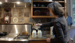 Suzanne Mossetto adds yogurt culture to heated raw milk in the process of making yogurt. Mossetto, who lives in Cherry Hill, purchases the raw milk from a group of farms in Pa.