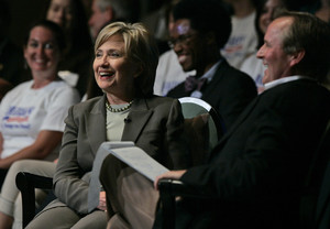 Some strategists say uncertainty over primaries helps national front-runners, Sen. Hillary Rodham Clinton - shown at a fund-raiser yesterday with author John Grisham - and Rudy Giuliani.