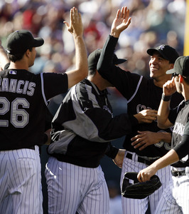 Rockies' Jeff Francis, Ubaldo Jimenez celebrate win over D-backs.