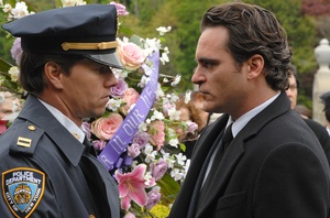 On opposite sides of the law, Mark Wahlberg (left), as a police officer, and brother Joaquin Phoenix, with a shady connection to organized crime.