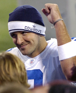 A happy Tony Romo leaves the field after cutting the Giants down to size. "We know he's our guy," Terrell Owens says.