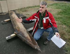 An iron-tipped lance designed to skewer British warships is viewed by Craig Bruns of the Independence Seaport Museum.
