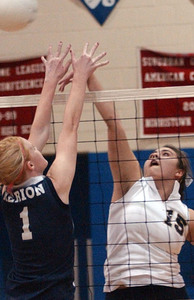 Helen Fitzpatrick goes to the net against Ali Koenig (15) of Upper Merion. She led Merion Mercy to a perfect record.