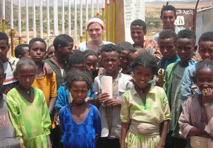 Brenna Bangs of Cabrini College (center, rear) with children in Ethiopia.