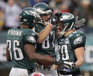 Reggie Brown and Brent Celek congratulate Kevin Curtis after he recovered Brown's fumble in the end zone for a touchdown. It was the second straight week that Curtis recovered a fumble in the end zone for a score.