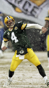 Green Bay Packers quarterback Brett Favre throws a snowball toward teammate  Donald Driver as they celebrate a touchdown in the second half against the  Seattle Seahawks. The Packers defeated the Seahawks 42-20