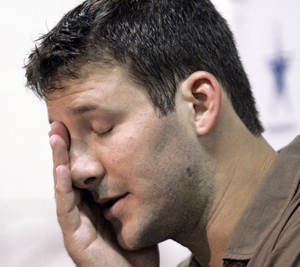Tony Romo, facing media after playoff loss, became an easy target after his Mexican vacation.