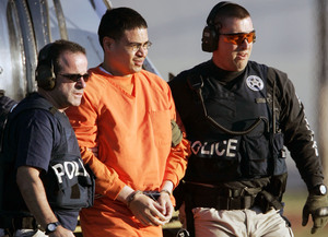 Jose Padilla (center) was escorted by federal marshals in 2006 upon his arrival for trial. His lawyers have argued that he should be treated as a criminal defendant rather than a prisoner of war.