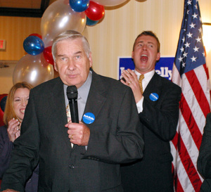 Councilman Jack Kelly (center), shown after winning re-election in November. His chief of staff, Chris Wright (right), is being investigated by the feds.