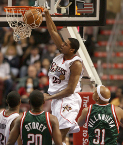 Rodney Carney throws down a dunk during fourth quarter of Sixers' rout of Milwaukee.