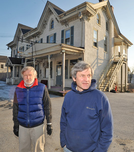 In front of the old Guthriesville General Store are brothers Bill (left) and Deke Inslee, who own three neighboring buildings and oppose a proposal to demolish the structure.