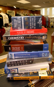 College textbooks cost $900 a year, on average. Factors include unaware teachers and ever-newer editions. Publishers say they have only so much control.