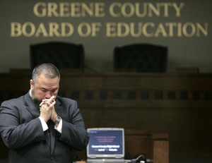 Greene County School Superintendent Shawn McCollough listens to a parent's question while explaining the plan, aimed at addressing a number of problems. "If we're going to take some steps, let's take some big steps," he said.