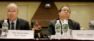Verizon's Tom Tauke and Comcast's David Cohen at the network-neutrality hearing Mondayat Harvard. Comcast feared a loud and critical crowd at the hearing where Cohen was to testify.