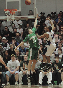 Camden Catholic's Gerry Wixted (25) tries to block a shot by Paul VI's Jon Grimes (14). Wixted scored a game-high 17 points for the Irish.
