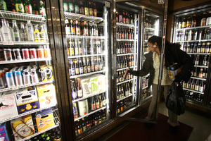 Kendra Amos of Fishtown buys beer at the Foodery in Northern Liberties.