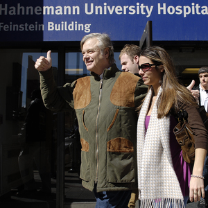 State Sen. Vincent Fumo leaves hospital with his daughter yesterday.