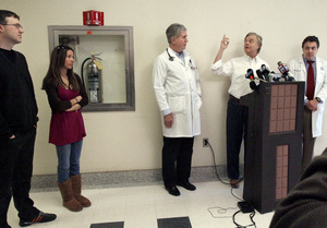 State Sen. Vincent J. Fumo (at lectern) discusses his medical situation. With him (from left) were son Vincent Jr., daughter Allison, and physicians Daniel McCormick and Howard Eisen.