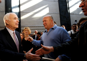 Sen. John McCain greets workers in St. Louis. He said his inquiries into the bidding were meant to keep the process fair.
