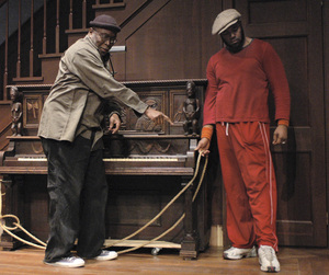 Walter Dallas (left) discusses the staging of August Wilson's play at the Arden with actor Kes Khemnu, who plays Boy Willie. The carved piano is a rich symbol of the past.