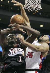 Samuel Dalembert has his shot blocked by the Pistons' Rasheed Wallace. Dalembert had six points and 15 rebounds.