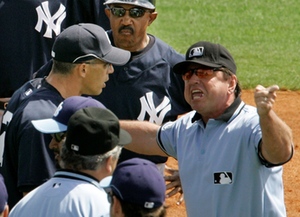 Umpire Charlie Reliford is confronted by Yanks manager Joe Girardi during Wednesday's dispute.
