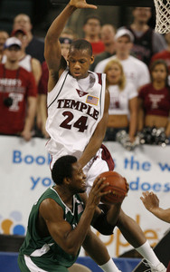 Temple's Lavoy Allen defends Charlotte's Gaby Ngoundjo in the A-10 semifinal game. The Owls' last NCAA trip was 2001.