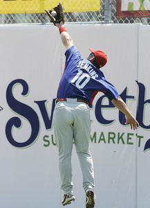 Geoff Jenkins makes leaping catch of ball hit by Jays' Vernon Wells.