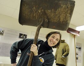 NYU instructor Robin Nagle holds a 1950s scraper in her exhibit. She hopes to build a permanent museum. Without the army of trash haulers, she says, life in New York would be impossible.
