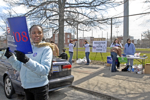 Volunteer Shannon Fox, 14, holds an Obama campaign sign outside Chew Playground during the March 15 cleanup. The goal was to clean the playground as well as register new voters.