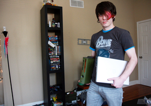 Jesse McPherson shows off his Xbox 360 and Apple PowerBook that were stolen from his house and were returned to him after he ignited a worldwide cyber-sleuth effort.