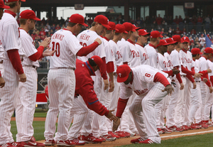 J.C. Romero and Ryan Howard exchange low-fives during pregame introductions.