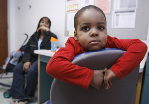 Yanaan waits with his mother, Nakia East, in a Children's Hospital exam room. The boy, who turns 3 this month, has Type 1 diabetes, and his blood sugar must be frequently monitored.