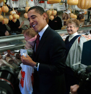 Sen. Barack Obama leaves Claudio Specialty Food, a meat-and-cheese shop in the Italian Market, with some gourmet cheese. He was impressed by the salami, too.
