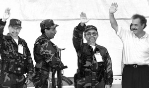 In 1999, the FARC's leader Luis Edgar Devia Silva (second from right) with then-Colombian President Andrés Pastrana (right).