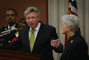 House Speaker Dennis O'Brien responds yesterday at a news conference in which D.A. Lynne Abraham (right) voiced support for O'Brien's crime-fighting efforts. Both talked about O'Brien's vote against a gun-control amendment last week.