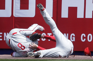 Shane Victorino makes catch and hangs on despite collision with Jayson Werth in right-center.