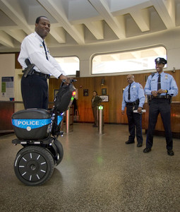 Lt. Jonathan Josey takes a spin on a Segway in the lobby of Police Headquarters. A 10-day trial starts this morning.