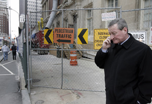 Councilman James F. Kenney , here on Arch near Broad, thought Philadelphia building sites littered with chain-link fences were just part of big-city living - until he visited New York.
