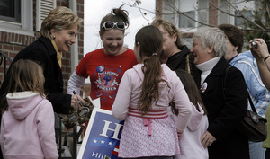Hillary Rodham Clinton talks with the Reynolds family in Drexel Hill while signing her book. Another Drexel Hill resident said she found Obama's remarks insulting.