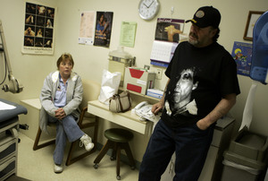 Donald Farr, a disabled construction worker, waits with his wife, Irene, for free medical care at the BCHIP clinic in Bensalem. "I worry from day to day how we're going to survive," she says.