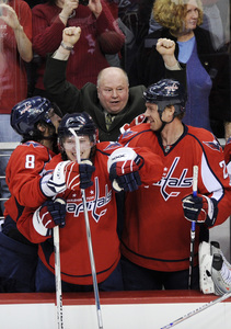 Capitals coach Bruce Boudreau celebrates with (from left) Alexander Ovechkin, Nicklas Backstrom and Viktor Kozlov.