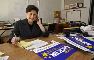 Anne Dicker, Democratic state Senate candidate, works the phones at her headquarters. "We are going to work this thing," she said.
