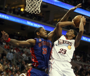 Amir Johnson defends Sixers' rising star Lou Williams in teams' final matchup, April 9.