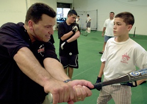 John Marzano, showing a boy how to swing a bat at his baseball academy, was a Philly guy through and through.
