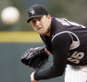 Rockies starter Mark Redman throws during the first inning of last night's game in Denver.