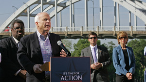 With the Edmund Pettus Bridge in the background, Sen. John McCain addressed a small crowd of about 100, mostly white.