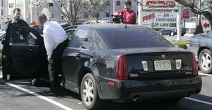 Sharpe James, former legislator and mayor of Newark, N.J., gets into the car with the vanity plate.